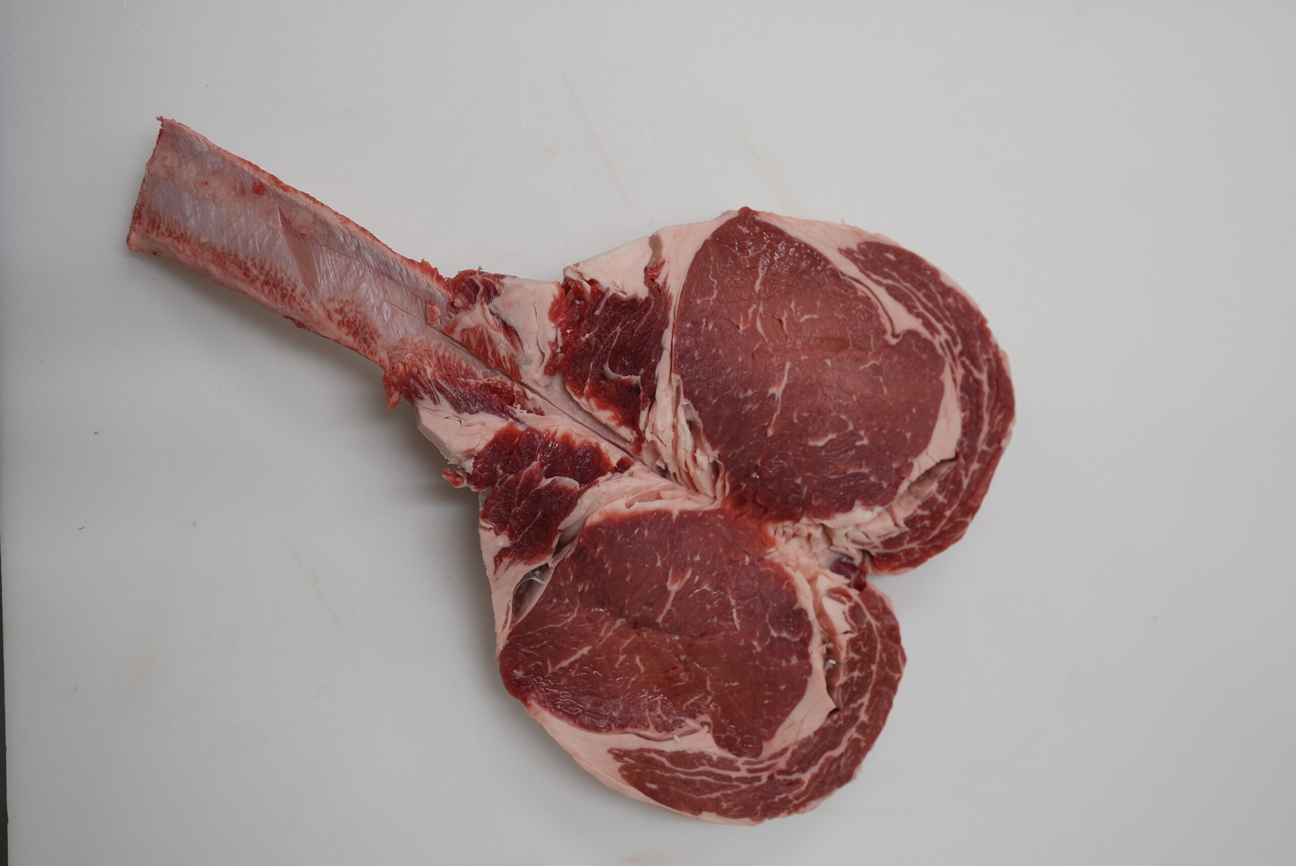 Raw gourmet steak in the shape of a heart