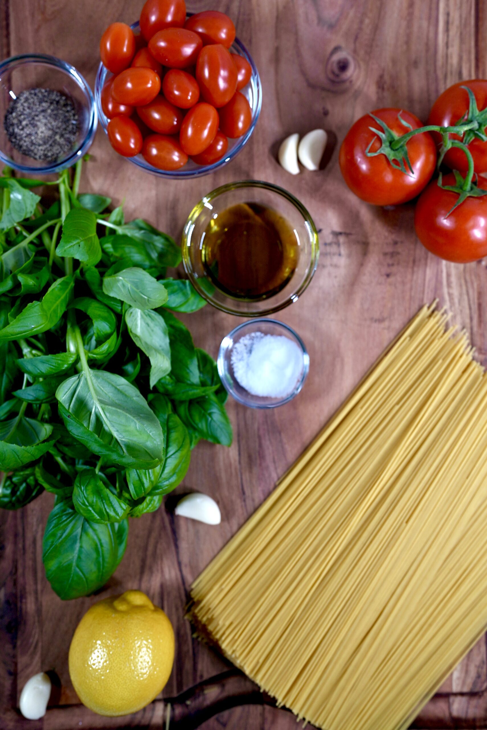 Fresh pasta ingredients, including tomatoes, garlic, and basil